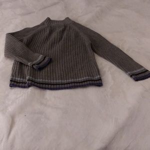 This a sweater for a 4 your old kid. Gray in color, and made by Sonoma.